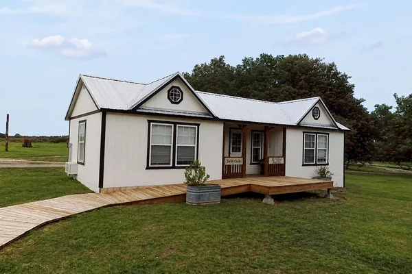 The bridal suite cottage with its porch and boardwalk