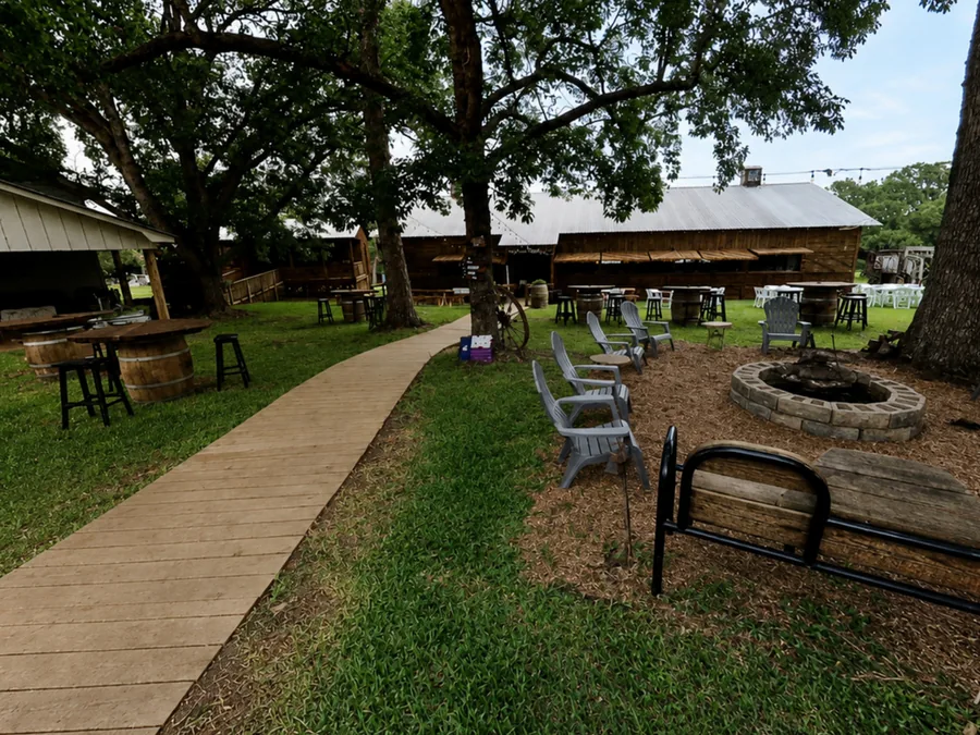 Fire pit and chairs under the oaks