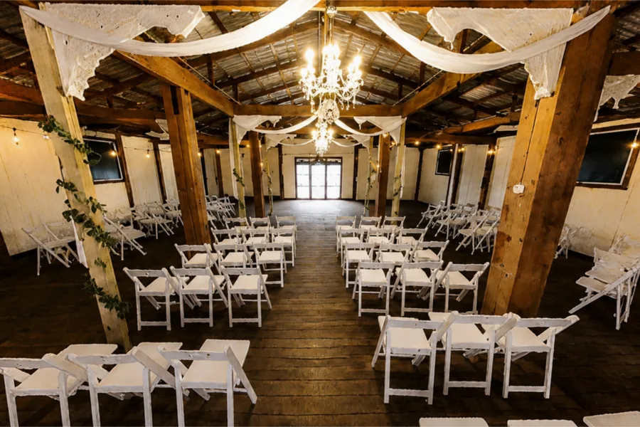The event barn set for a reception with chandeliers