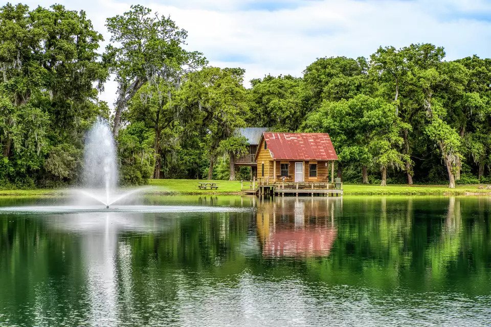 The lake cabin and fountain at Twin Oaks