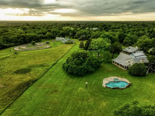 Aerial of the ranch, pool, and go-kart track